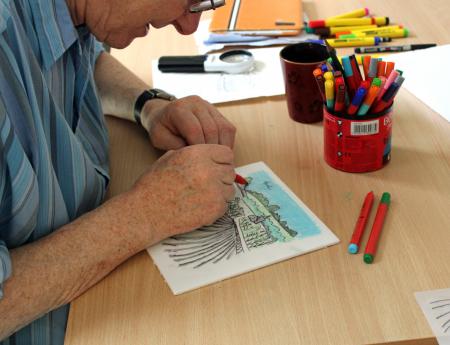 Visually impaired artist David Foulds creating a watercolour painting