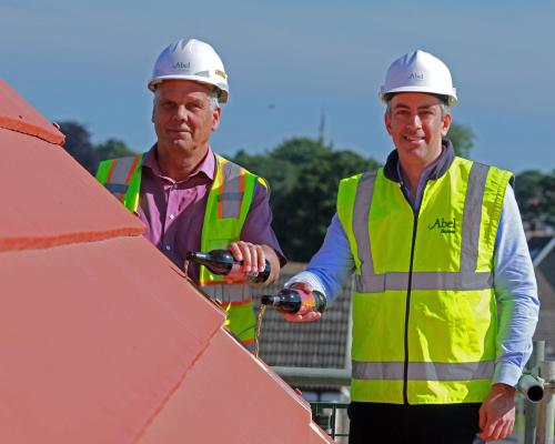 Abel Homes managing director Paul LeGrice right and site manager John Bright top out the new home at Swaffham sm