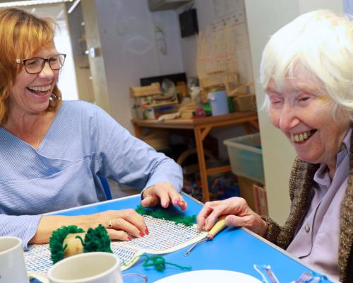 Christine Pyzer left of Ruskins Rugs helps Dawn Wright at the Vision Norfolk rug making workshop sm