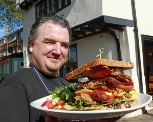 The Britons Arms head chef Richard Ellis with the Ultimate Norfolk Piggy Club Sandwich sm