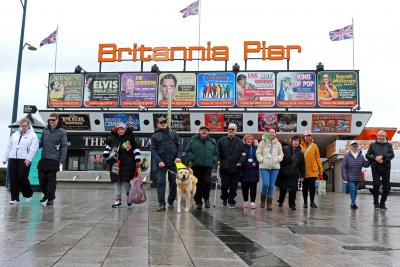 A group of vision impaired walkers from Vision Norfolk step out for a walk on Great Yarmouth seafront sm
