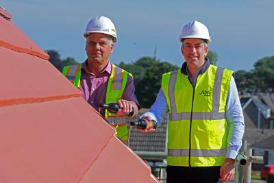 Abel Homes managing director Paul LeGrice right and site manager John Bright top out the new home at Swaffham sm