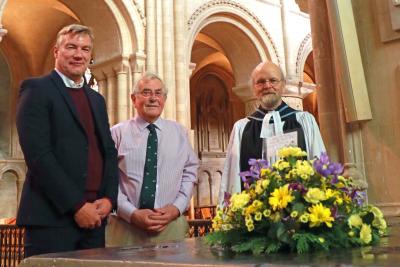 Andrew Morter Peter Spaul and Canon Andy Bryant lay flowers at the memorial to Thomas Tawell in Norwich Cathedral sm