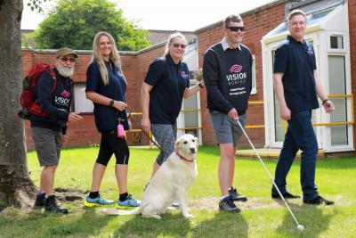 Getting ready to climb Snowdon are the team from Vision Norfolk sm