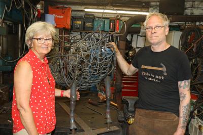 Maggie Abel of Abel Homes and Nigel Barnett of Fransham Forge with the frame for the sheep sculpture sm
