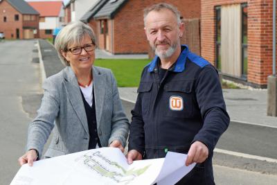 Maggie Abel of Abel Homes and stonecarver Teucer Wilson plan the new artwork at East Harling sm