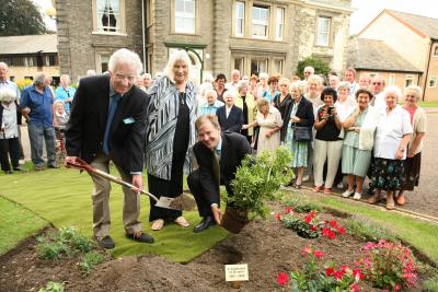 Martin Miller holding spade pictured at The Cedars in Norwich in 2006