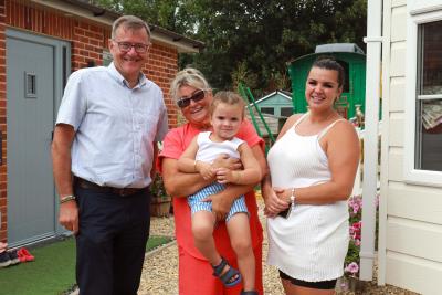 Michael Newey of Broadland Housing with Emily Brazil centre her niece Emma Lee and her son William Lee sm