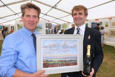 RNS Art Exhibition head steward Tom Cringle and Guy Gowing from Arnolds Keys with the winning picture sm