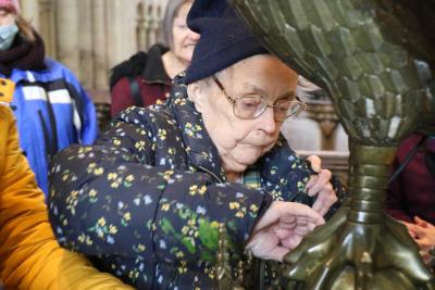 Vision impaired Great Yarmouth woman Brenda Hammond gets hands on with the lectern at Norwich Cathedral sm